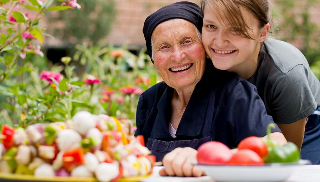 smiling elderly woman and daughter local home health care agency