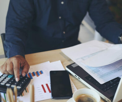 Man Completing Taxes and Figuring His Tax Deductible Donations