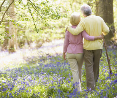Two Ladies Walking Through Nature Discussing Four Levels of Hospice Care