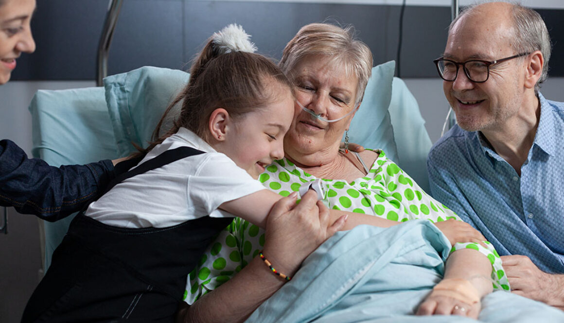 A Child Hugging An Elderly Woman Who Is Laying In A Hospital Bed Should You Take A Child To Visit A Relative In Hospice