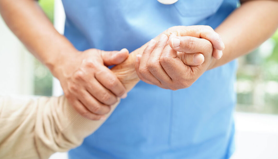 Doctor Holding The Hand of an Elderly Hospice Patient What You Don't Know About Hospice Care