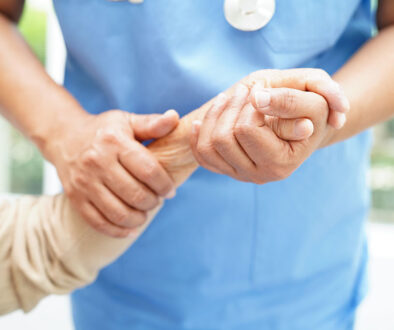 Doctor Holding The Hand of an Elderly Hospice Patient What You Don't Know About Hospice Care