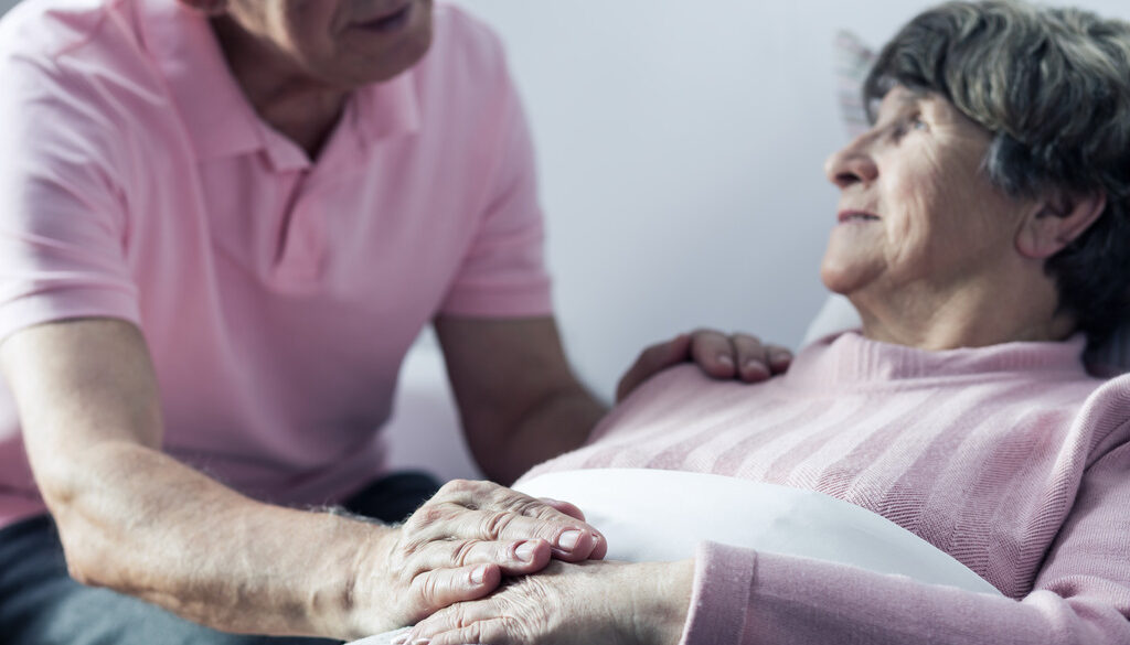 Closeup of an Elderly Man Comforting His Wife Laying Down Can a Hospice Patient Change Their Mind