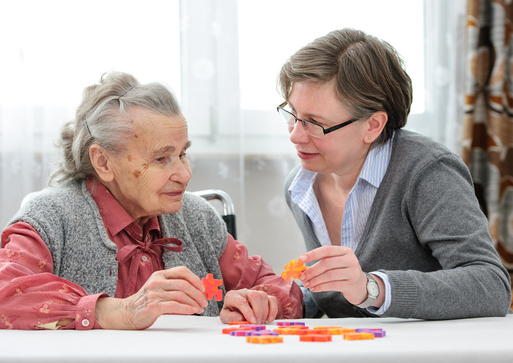 Senior Woman Putting Together A Puzzle